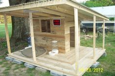 a small wooden structure with a hot tub in it