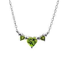 Perfect for the August princess, this triple-heart necklace is certain to make her birthday - or any day - a special one. Fashioned in sleek sterling silver, three heart-shaped spring-green peridots sparkle in a neat row, separated only by shimmering diamond accents. Polished to a brilliant shine, this 18.0-inch cable chain necklace secures with a spring-ring clasp. Silver Heart Cut Necklace For May Birthstone, Green Sterling Silver Heart Pendant Necklace, Green Sterling Silver Necklace With Heart Charm, Green Heart-shaped Sterling Silver Necklace, Green Heart Pendant Necklace For Mother's Day, Silver Diamond Necklace, Peridot Jewelry, Silver Necklaces Women, Cable Chain Necklace