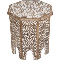 an octagonal wooden table with intricate carvings