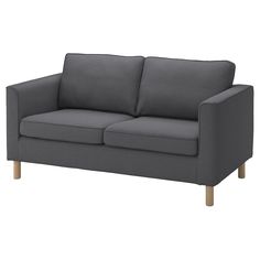 a gray couch with two pillows on the back and one arm folded up in front