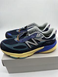 Get ready to step up your shoe game with these New Balance 990v6 sneakers! Embrace the vintage style with the multicolor lapis lazuli baklava design, perfect for any occasion. Made with suede upper material and a standard shoe width, these sneakers are both comfortable and stylish. The New Balance 990v6 Action Bronson edition is a must-have for any sneakerhead. With a UK shoe size of 6 and a US shoe size of 7, these sneakers are ideal for men who love athletic shoes. The New Balance 900 series product line is renowned for its quality and durability, and this particular model lives up to the hype. Don't miss out on the chance to own this amazing sneaker! Blue New Balance Sneakers With Air Cushioning, Blue Sneakers With Ortholite Insole For Streetwear, Blue New Balance Sneakers For Running Errands, Blue Sneakers With Vibram Sole For Running Errands, Blue New Balance Low-top Walking Shoes, Casual Blue New Balance Walking Shoes, New Balance Blue Walking Shoes With Round Toe, New Balance Blue Walking Shoes With Cushioned Footbed, Blue New Balance Walking Shoes With Cushioned Footbed