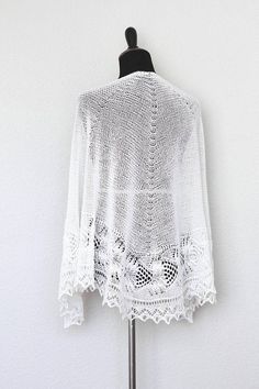 This hand knit shawl is made of 100% wool in off-white color (natural white).   The shawl is half-circle shape and perfectly wide to wrap around the body.  Laced edge add f... #kgthreads White Shawl, Hand Knit Shawl, Bridal Cover Up, Knitted Cushions, Bridal Bolero, Knit Shawl, Bridal Shawl, Knit Pillow, Bridal Cape