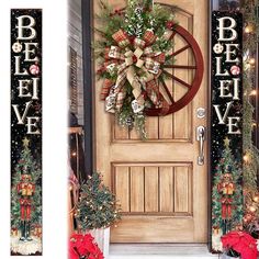 two christmas wreaths are hanging on the front door and behind them is a wagon wheel