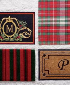 three christmas door mats with monogrammed letters and wreaths on them, along with a place mat for the letter p