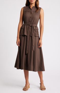 Cargo pockets lend utilitarian flair to a sleeveless midi dress cast in a delightfully earthy hue. 46" length (size Medium) Front button closure Band collar Sleeveless Side cargo flap-patch pockets Removable tie belt Unlined 65% polyester, 35% nylon Dry clean Imported Brown Workwear Dress With Pockets, Sleeveless Workwear Dresses With Slip Pockets, Khaki Sleeveless Dress With Pockets, Utility Style Summer Dresses For Workwear, Summer Utility Dresses For Workwear, Brown Spring Midi Dress With Pockets, Utility Style Summer Workwear Dresses, Summer Utility Workwear Dresses, Olive Sleeveless Midi Dress