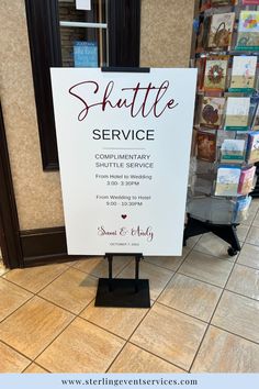 a sign that says shuttle service on it in front of a store display case with the words shuttle service written on it