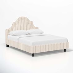 a bed with white sheets and pillows on it's headboard, against a white background