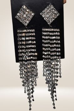 Rhinestone Chain Tassel Long Chandelier Drop Earrings Wear these earrings to make a statement. These Chandelier Drop Earrings are perfect for any occasion, whether it be a wedding, date night, or party. They are designed in an elegant chandelier style that cascades beautifully to look great with any dress style. The earrings are made with high-quality rhinestones and metal material that will give you years of wear and tons of compliments. Zinc Alloy Material Fairy Pattern Gold And Silver Detail Glamorous Metal Chandelier Earrings With Rhinestones, Metal Tassel Drop Earrings For Party, Elegant Silver Tassel Earrings For Party, Crystal Chandelier Dangle Earrings For Glamorous Events, Glamorous Metal Crystal Earrings For Evening, Chic Crystal Earrings With Rhinestones For Party, Chic Party Crystal Earrings With Rhinestones, Glamorous Crystal Earrings For Evening, Glamorous Metal Bridal Earrings For Party