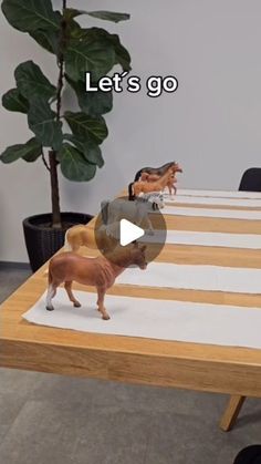 a table with toy animals sitting on top of it