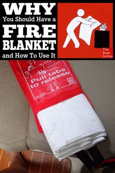 a red and white fire blanket sitting on top of a couch