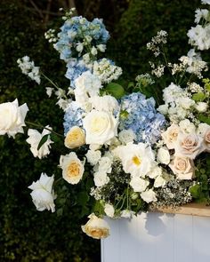 a bunch of flowers that are sitting on a table