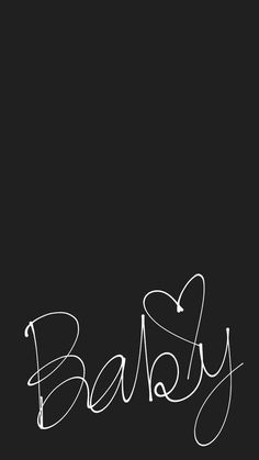 the word baby written in cursive writing on a black background with white ink