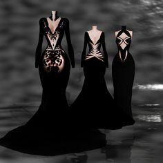 three mannequins are standing in the water wearing black and white gowns