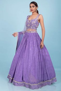 This Party Wear Lehenga D-302 features intricate stone, zardozi, and mirror work, adding a touch of elegance and glamour to any special occasion. Crafted with expert craftsmanship, this lehenga promises to make you stand out with its beautiful embellishments and luxurious design. Elevate your style game with this stunning lehenga. Modern Lehangas, Lavender Lehenga, Glamour Clothing, Dandiya Dress, Haldi Dress, Ghaghra Choli, Autumn Palette, Dark Autumn, Desi Style