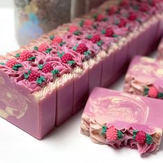 some pink soaps with raspberries on them