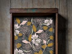 a wooden frame with a floral print on it