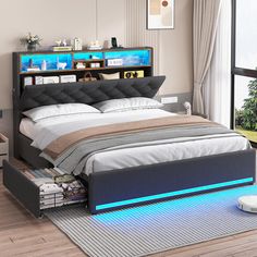 a bed with a lit up headboard and foot board on the side, in front of a window