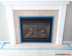 a fireplace with blue tape around it