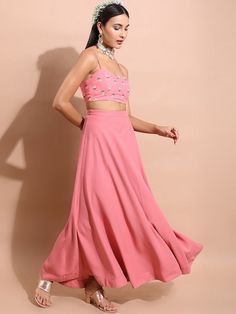 This ethnic co-ord set consists of a top, palazzos, and a jacket Pink & green floral printed cropped-top, has shoulder straps, sleeveless and slip-on closure Pink solid palazzos has a slip-on closure Comes with a matching printed jacket with short regular sleeves Size & Fit Please check the last image above for a complete size chart. Material & Care Top: Polyester Palazzos: Polyester Jacket: Polyester Machine Wash Fitted Bollywood Choli For Spring, Fitted Spring Bollywood Choli, Summer Party Sets With Long Skirt, Summer Georgette Palazzo Set Maxi Length, Summer Maxi Length Georgette Palazzo Set, Traditional Long Skirt Sets For Summer, Spring Pink Sets With Unstitched Blouse, Traditional Summer Festive Crop Top, Fitted Palazzo Set For Spring