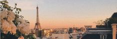 the eiffel tower towering over paris is seen in the distance from rooftops