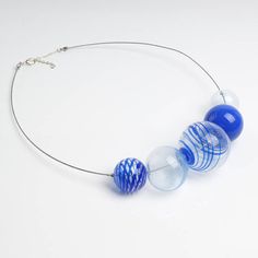 "This Big blue necklace is made of glass in the lampwork technique, each bead is hand blown and unique. This blue chunky necklace is lightweight, stylish and elegant and will become a versatile and irreplaceable addition to your everyday outfits! 💕 You will definitely look stunning in this glass bubble necklace! Dimensions: the necklace length is adjustable, 20\"-22\" inch (51-56cm). Materials: artist lampwork glass beads, metal fittings. 🎁 This large bead necklace will also be a great gift fo Blue Round Glass Necklaces, Blue Glass Round Necklaces, Blue Murano Glass Beaded Necklace With Large Beads, Blue Round Glass Beaded Necklace, Navy Necklace, Bubble Beads, Large Bead Necklace, Lampwork Necklace, Fruit Necklace