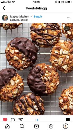 several cookies with chocolate frosting and nuts on a cooling rack