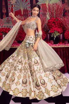 Ivory two layer can can attached bridal lehenga featuring thread embroidered floral and half moon motifs, embellished by mirrorwork, gota and beads. Comes with floral zardozi embroidered blouse and dupatta. - Aza Fashions White Wedding Dress With Motifs, Bollywood Style Ceremony Sets With Floral Embroidery, Wedding Embroidered Off-white Choli, White Wedding Sets With Motifs, Embroidered Off-white Wedding Choli, Wedding Embroidered Fitted Fabric With Motifs, Fitted Embroidered Fabric With Motifs For Wedding, Traditional Choli With Floral Embroidery For Ceremony, Ceremonial Choli With Floral Embroidery In Traditional Drape