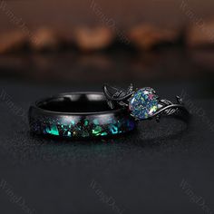 Orion Nebula Ring Set, Black Opal Engagement Ring Set, Black Gold His and Her Wedding Band, Mens Tungsten Ring, Nature Inspired Bridal Set -----Ring Information----- Metal Type: 925 sterling silver, Tungsten ✦ Her Ring 925 solid sterling silver with black rhodium finish (message me if you need other band color or metal) Center stone: Lab created black opal Stone size: 6.5mm round cut (message me if you need other stones) ✦ Please feel free to contact me if you have any questions or you are inter Unique Engagement Rings Black Opal And Silver, Luxury Black Opal Engagement Ring, Black Australian Opal Ring, Dark Opal Engagement Ring, Black Gemstone Engagement Rings, Black Fire Opal Engagement Ring, Black Opal Ring For Anniversary, Black Opal Round Jewelry, Black Opal Gemstone Ring