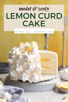 a frosted cake with lemons and white icing