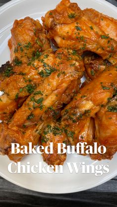 baked buffalo chicken wings on a white plate