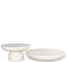 two white plates sitting next to each other