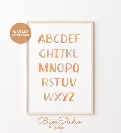 the printable alphabet is displayed in front of a white wall