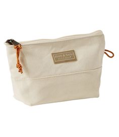 We make this classic canvas pouch right here in Maine - carry it on its own or inside one of our Boat and Totes. 100% cotton canvas. Spot clean. Same durable cotton canvas fabric as our iconic Boat and Tote. Overlapped seams are double-stitched with nylon so they won't rot or break. Zipper pull is made with our Bean Boot laces. Pouch keeps smaller items organized inside your backpack or tote. Stands upright on its own. Made in Maine. Boat And Tote, Boot Laces, Boat Tote, Canvas Cosmetic Bag, Travel Bag Organization, Cotton Canvas Fabric, Bean Boots, Travel Stuff, Travel Toiletries