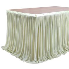 a table with a long pleated skirt on it