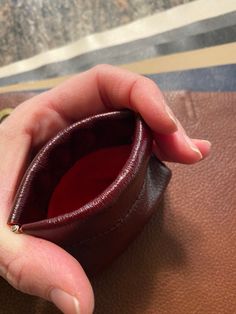 "This leather pouch is a great way to store earbuds, coins, jewelry, and other small items. It is made from 100% leather and secured with a \"snap\" Flex Frame. This pouch measures 3.75\" at its bottom widest point. It is 3.5\" high and the opening of the pouch has a 3.25\" flex frame snap closure." Classic Leather Coin Purse With Interior Key Chain Holder, Gift Pouch With Interior Key Chain Holder, Brown Leather Coin Purse With Interior Key Chain Holder, Compact Leather Pouch For Everyday Use, Soft Leather Pouch For Personal Use, Compact Leather Zipper Pouch, Compact Brown Leather Coin Purse, Compact Leather Coin Purse For Everyday Use, Compact Leather Coin Purse With Zipper