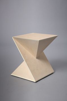 a wooden table that is on top of a gray surface with no one around it