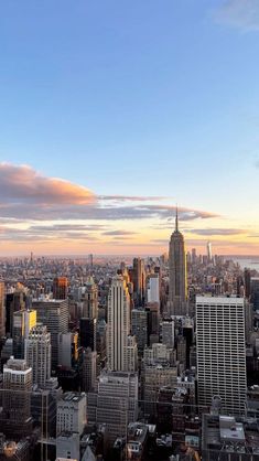 an aerial view of new york city at sunset