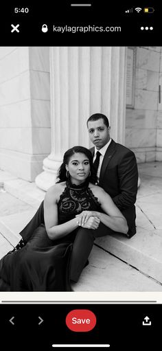 a man and woman sitting next to each other in front of a building with columns