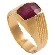 18K yellow gold ring centered by a red stone. Size: 59. Gross weight: 3.77 grams. Fine Jewelry Ruby Signet Ring For Formal Occasions, Ruby Signet Ring Fine Jewelry For Formal Events, Ruby Signet Ring For Formal Occasions, Formal Ruby Signet Ring In Fine Jewelry Style, Gold Ruby Signet Ring For Formal Occasions, Formal Ruby Signet Ring, Classic Red Signet Ring For Formal Occasions, Formal Red Birthstone Ring With Polished Finish, Formal Red Polished Birthstone Ring