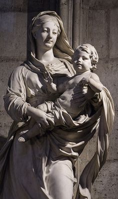 a statue of a woman holding a child