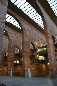 the inside of a building with arches and windows