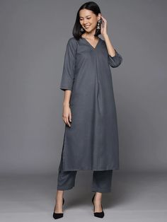 Redefine classics with our kurta sets. This stunning set was crafted from the finest cotton blend in a striking sharp grey hue making it a chic sartorial pick for a stylish office soiree or a quick fun day out with friends and family. Add this stylish piece to your collection now! No. of pieces - 2 piece set. Color - Grey. Fabric - Cotton Blend. Washing Instructions - Dry Clean.