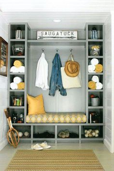 an image of a closet with clothes and other items on it's shelfs