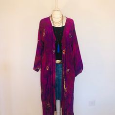 "A Stunning Sequinned, Boho Hippie Kimono Jacket. Tie dyed, loose and floaty;Perect for Beaches,holidays and Parties as a Cover Up Robe. Handmade from a Vintage Indian Sari so completely original and sustainable. A Wonderfully Chic, Flattering Hand Tie Dyed Silk , with a Lovely design featuring Golden beaded paisleys and Sparkling Sequins and Crystals catching the Light. There is a soft sash belt with Silk Tassles to adjust the shape. This Robe is Soft,light,floaty, elegant and versatile,and will look stunning dressed up or down for years to come , for glamorous Holidays , Parties , Special occasions and Celebrations. One Size S M L XL Will flatter UK size 10 to 18 ,  US size 6 to 14 , European 38 to 48  The length is 120 cm / 47.5  \"  This beautiful unique jacket will soon become a Favou Fitted Bohemian Kimono For Festivals, Festival Long Sleeve Kimono One Size, Long Sleeve Festival Kimono One Size, Bohemian Fitted Kimono For Festive Occasions, Fitted Bohemian Kimono For Festive Occasions, Festive Bohemian Fitted Kimono, Fitted Long Bohemian Kimono, Bohemian Embroidered Fitted Kimono, Embroidered Fitted Bohemian Kimono