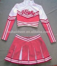 a cheerleader uniform is displayed on the floor in front of a gray sheet that says high