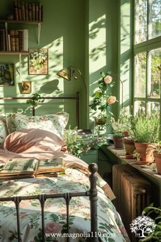 a bedroom with green walls and lots of plants