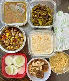 six plastic containers filled with food on top of a table