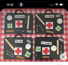 four paper cut out of medical items on a red and white checkered tablecloth