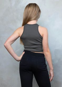 The RHEA Racerback Crop Tank Top offers ample stretch and features a high neck and racerback cut. The ribbed texture ensures lasting durability and offers a snug, comfortable fit. The crop design is perfect for tween sizes and active lifestyles. One Size Fits All Age: 10 years old Ribbed Racerback Crop Top, Ribbed Racerback Top For Athleisure, Casual Racerback Halter Top For Sports, Athleisure Ribbed Racerback Top, High Stretch Racerback Tank Top For Loungewear, Casual Seamless High Neck Tank Top, Casual Stretch Halter Top For Gym, Casual High Neck Seamless Tank Top, Casual High Neck Activewear For Gym