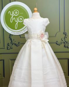 Brisas is a beautiful and elegant first communion dress, made in off-white rustic gauze. It has a beautiful pleated skirt with a scalloped edge. The flower applique can be used or not. Made in Spain Does not include crinoline Dry Cleaning Final Sale, no exchanges nor returns will be accepted after purchase Cream Dress With Ruffles For First Communion, White Floral Applique First Communion Dress, Elegant First Communion Gown For Spring, Fitted Floral Applique Dress For Confirmation, Elegant Floral Applique Dress For Baptism, Elegant Spring Gown For First Communion, Elegant Cream First Communion Dress For Spring, Fitted Floral Appliqué Dress For First Communion, Fitted Floral Applique Dress For First Communion